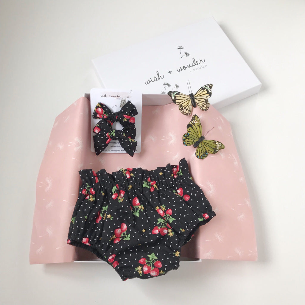 Baby and toddlers highwaisted bloomer shorts with two matching hair bows in strawberry and spot print.