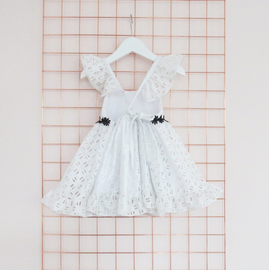 Summer silver foil cotton geometric broderie anglaise dress with frill sleeves.