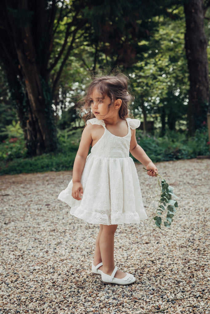 Summer Childs cream silk broderie anglaise dress with frill sleeves.