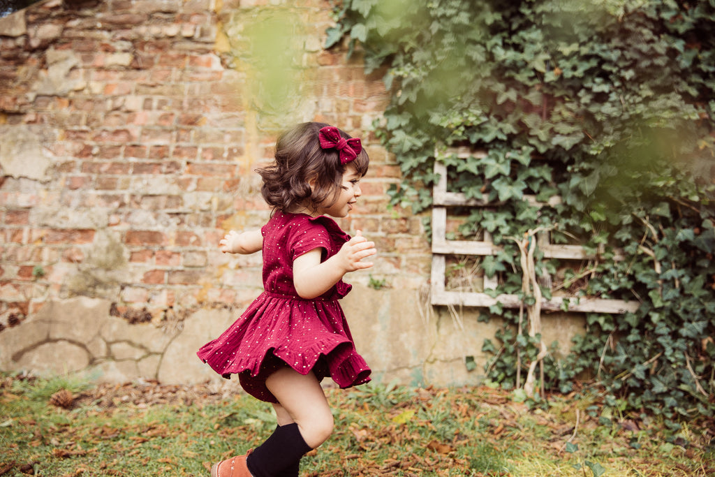 Childs Autumn Winter double gauze cotton frill dress with gold spot in cranberry